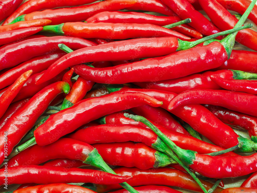 pile of fresh red hot Chillies Background