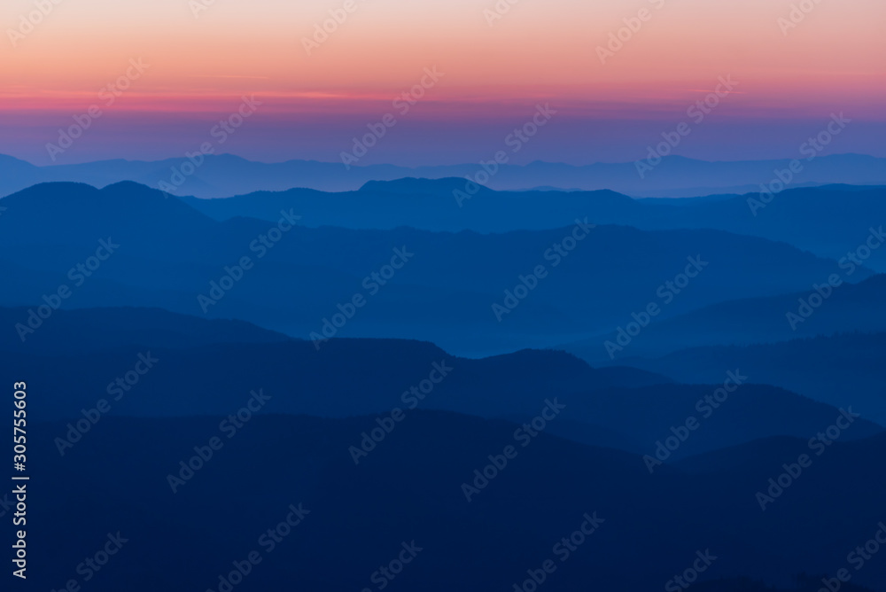 Mountain Silhouette cold blue mountains with mist