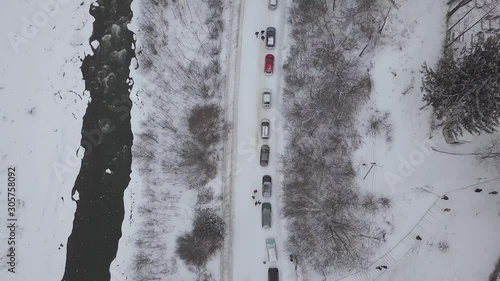 Aerial winter view to river Black Cheremosh in Carpathian village Kryvorivnia at cold day, Ukraine. Typical landscape in Hutsulshchyna National Park photo