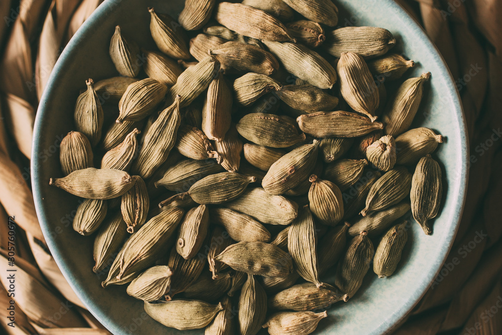 Heap of cardamom seeds in a bowl, close up view. Heap of cardamom seeds in a bowl, close up view.