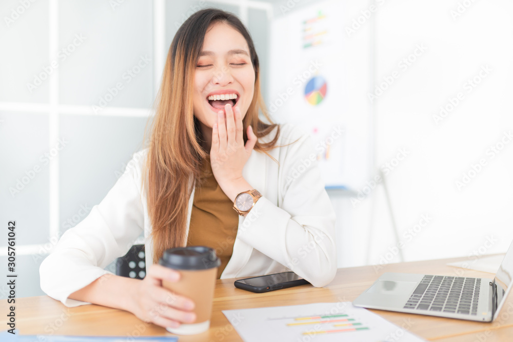 attractive asian officer laughing in relax time, asian female feeling happy in office, she use hand close her mouth, happiness organization attractive asian officer laughing in relax time, asian female feeling happy in office, she use hand close her mouth, happiness organization