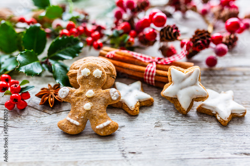 Homemade Christmas gingerbread cookies on wooden background.