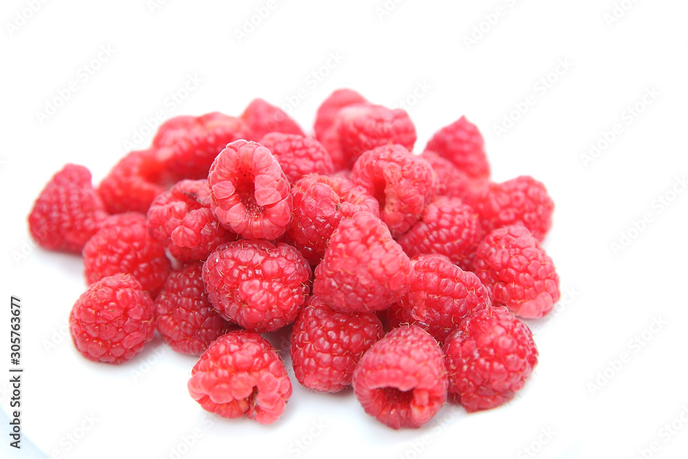 Closeup ripe sweet raspberries on white background. Selective focus. Closeup ripe sweet raspberries on white background. Selective focus.