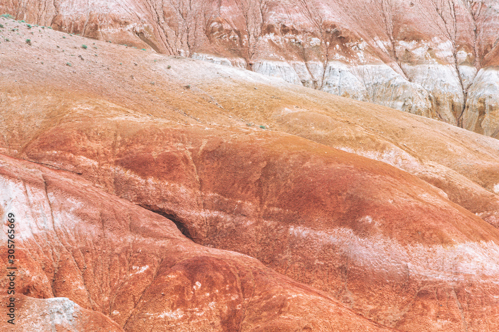 Rocks in canyon of dry river bed. Drought due to climate change. Soil erosion of hills. Red sand in mountains Rocks in canyon of dry river bed. Drought due to climate change. Soil erosion of hills. Red sand in mountains