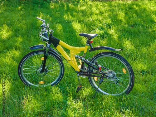 Full suspension mountain bike in grass