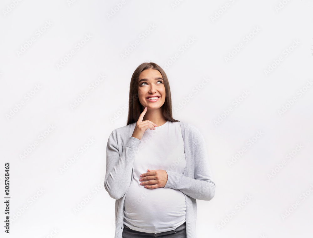 Happy Pregnant Girl Dreaming Standing Over White Studio Background Happy Pregnant Girl Dreaming Standing Over White Studio Background