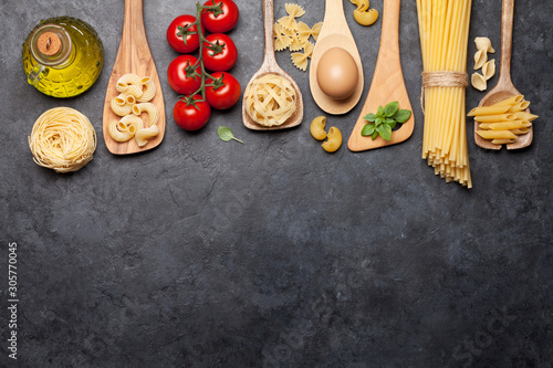 Various pasta in spoons photo