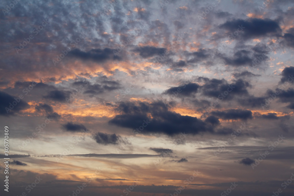 Obraz premium Dramatic red and orange sky and clouds abstract background. 