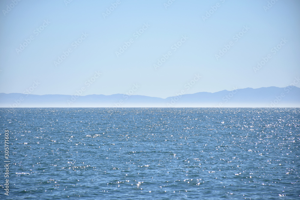 Silhouette of Channel Islands National Park seen from the shores of Santa Barbara on a perfectly sunny day, Santa Barbara, California