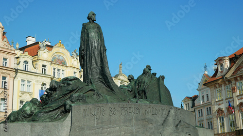 Jan Hus Memorial Old Town Square stands In Prague, statue of bronze stone depicts victorious Hussite warriors heroes or protestants, Historic, Artistic Art Nouveau architecture landmark, built 1915 photo