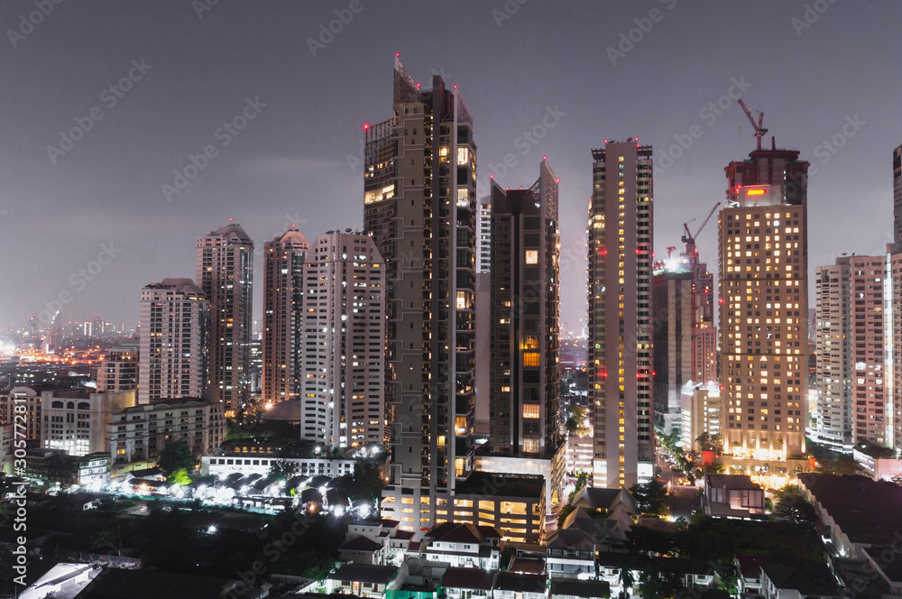Naklejka premium Bangkok night view with skyscraper in business district in Bangkok Thailand