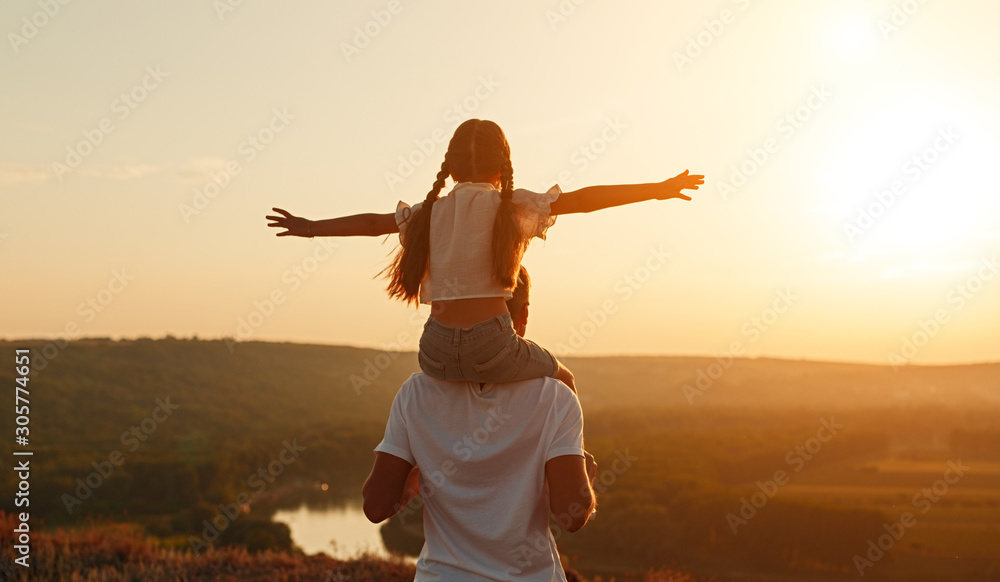 Unrecognizable father and daughter during evening in nature - obrazy, fototapety, plakaty 