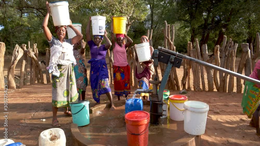 Water journey. Six woman and a baby make the long journey home carry