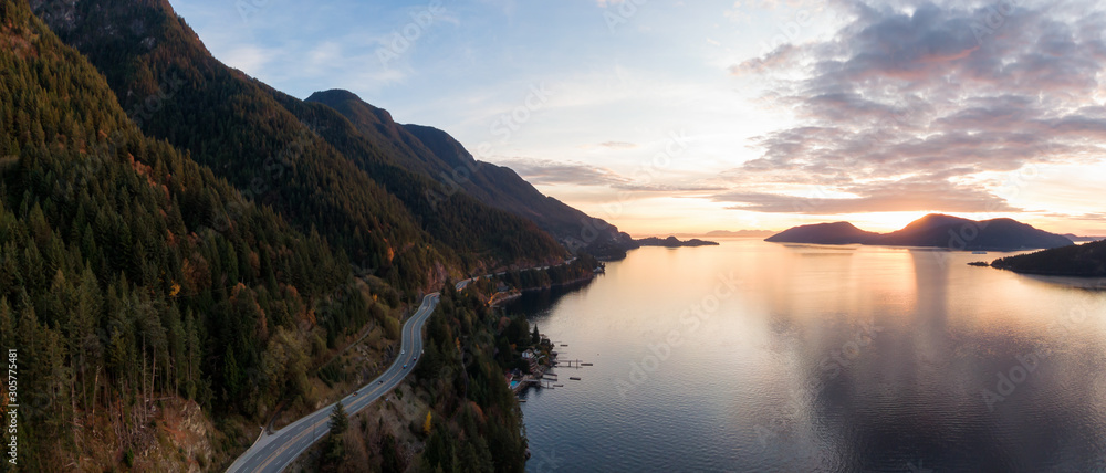 Sea to Sky Hwy in Howe Sound near Horseshoe Bay, West Vancouver, British Columbia, Canada. Aerial panoramic view during a colorful sunset in Fall Season.