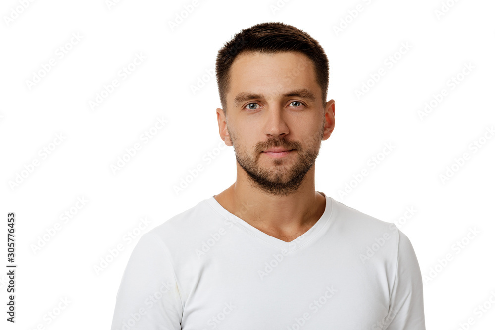young handsome bearded man in casual white sweater poses in studio on white background young handsome bearded man in casual white sweater poses in studio on white background
