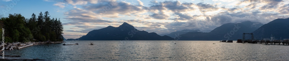 Beautiful Panoramic View of Howe Sound surrounded by Canadian Mountain Landscape during summer sunset. Taken in Porteau Cove, North of Vancouver, BC, Canada.