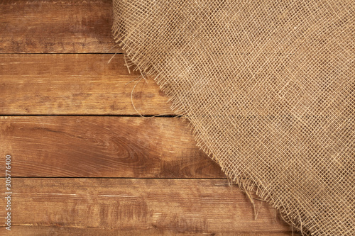 Burlap on a wooden background. Burlap texture.