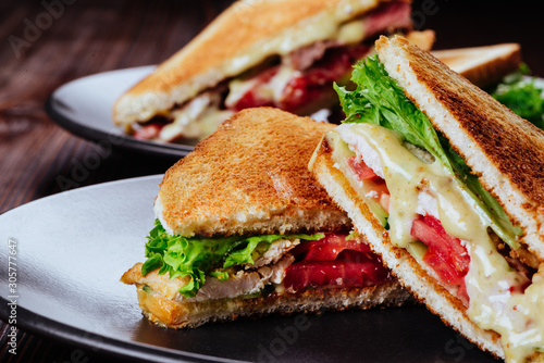 Sandwich bread tomato, lettuce and yellow cheese for breakfast