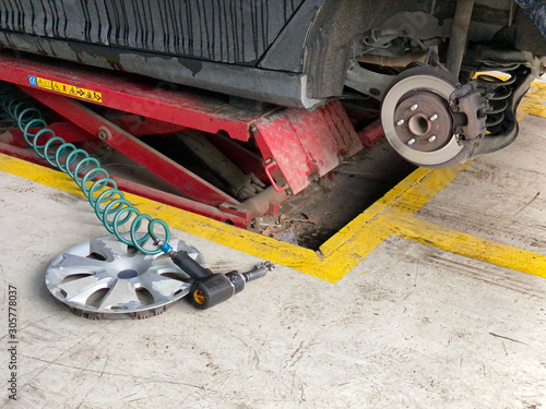 Inside a garage - changing wheels/tires  photo