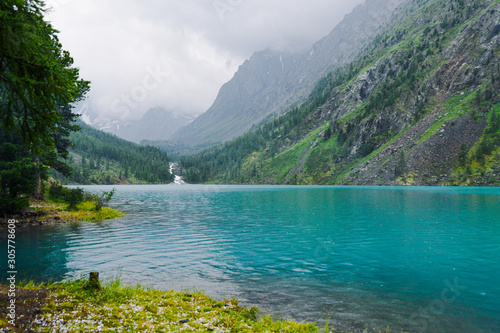 Turquoise lake among rocks. Mountain pond for hiking © Koirill