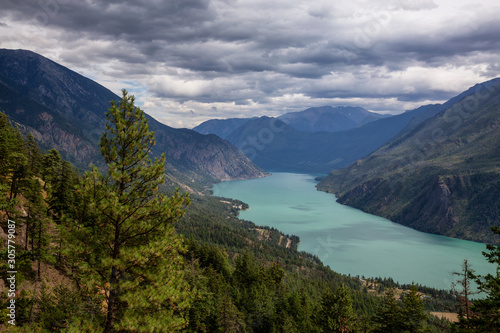 Beautiful View from Above of Seton Lake surrounded by Canadian Mountain Landscape during a summer day. Taken in Shalalth near Lillooet  BC  Canada.