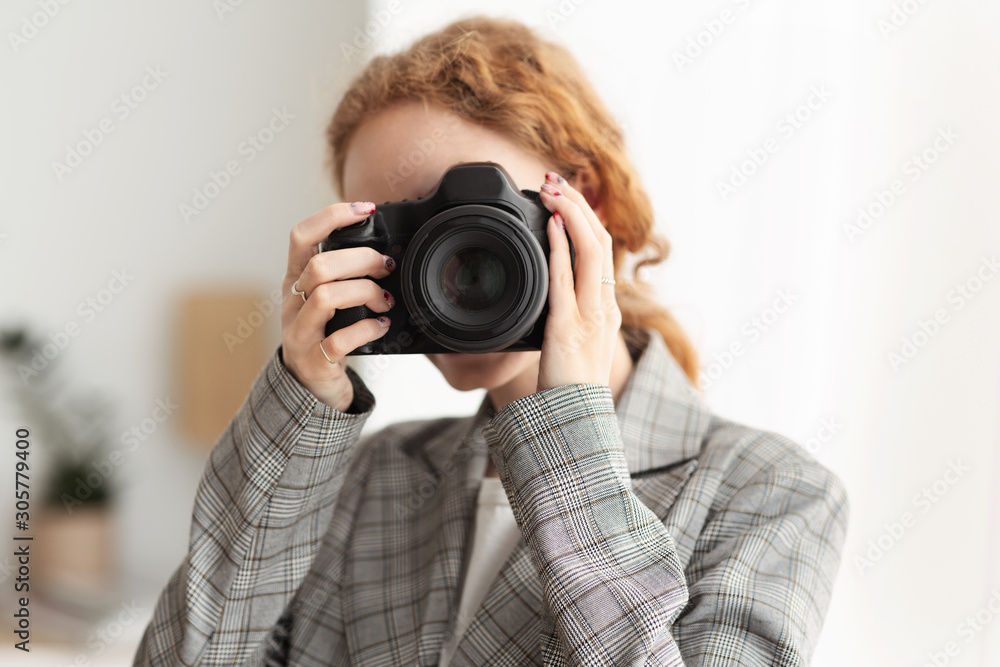 Successful photographer taking photo with professional camera Successful photographer taking photo with professional camera