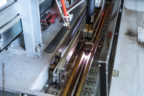 Working overlap arc welding machine. Welded seam. Welding sparks.