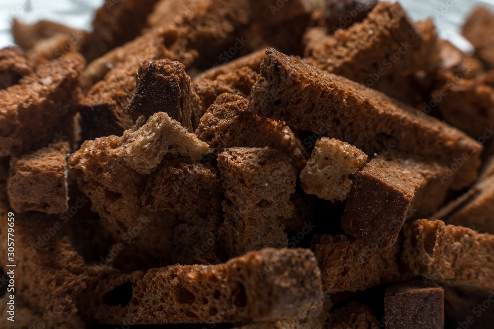 Rye crackers on green marble background close-up Rye crackers on green marble background close-up