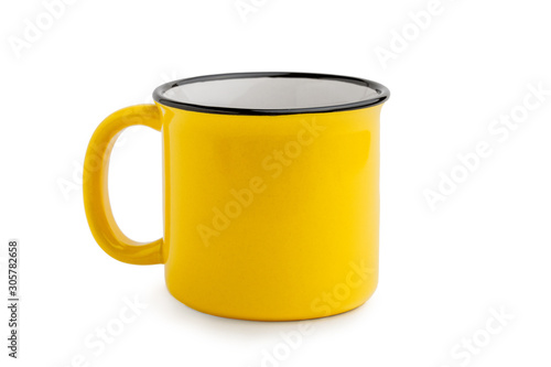 Quadro em tela Side view of empty yellow enamel coffee mug isolated on white background