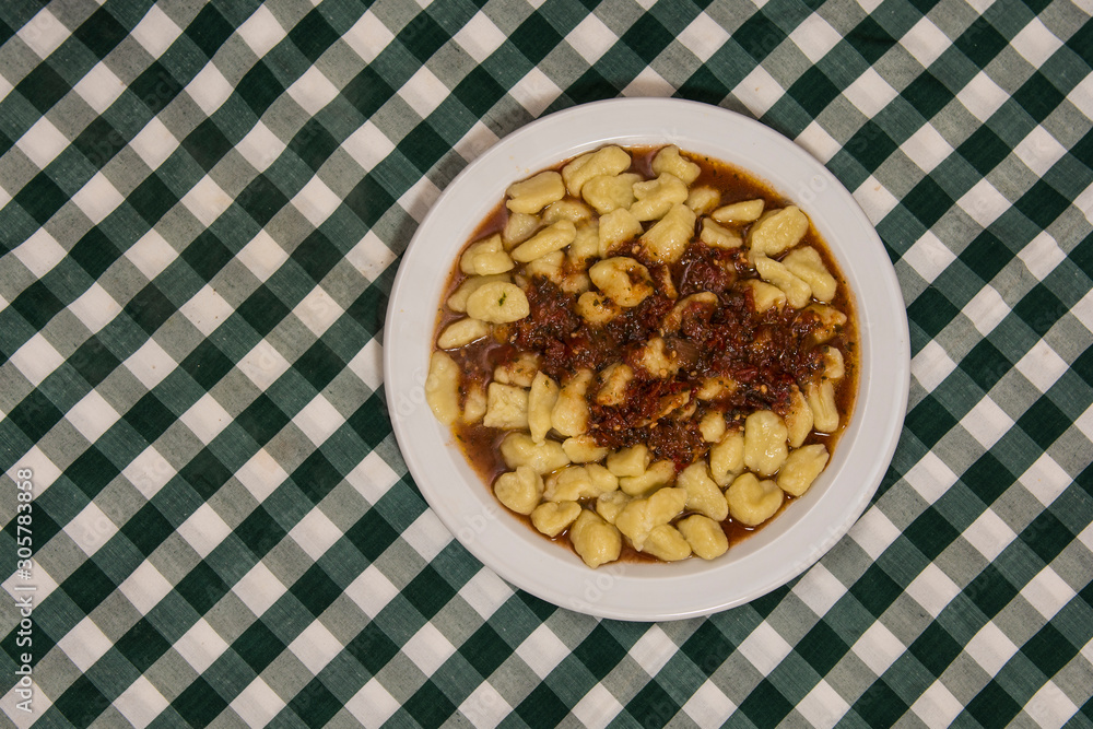 Plate of homemade gnocchi with tomato sauce Plate of homemade gnocchi with tomato sauce