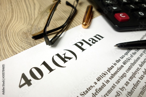 401k Plan with calculator pen and glasses