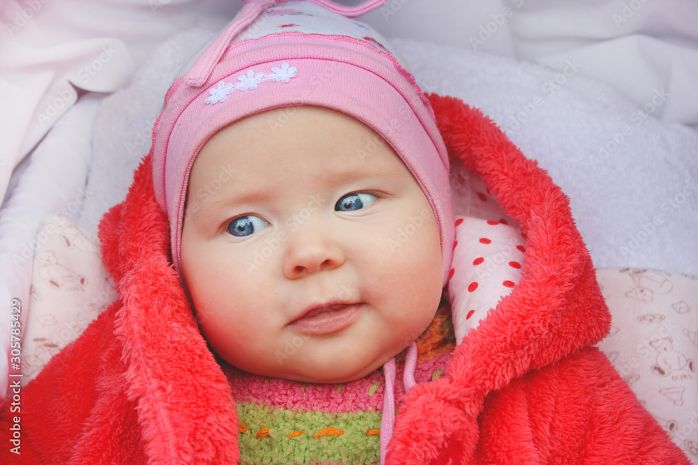 little baby smiling in perambulator during stroll little baby smiling in perambulator during stroll
