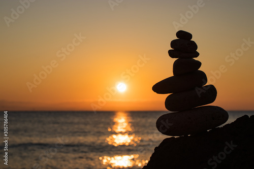 Zen concept. Sunset. The object of the stones on the beach at sunset.  Relax   Meditation. Zen stones.