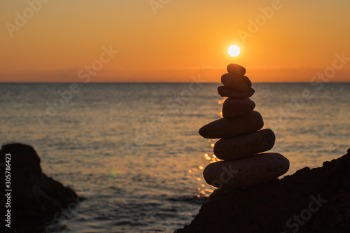 Zen concept. Sunset. The object of the stones on the beach at sunset.  Relax   Meditation. Zen stones.
