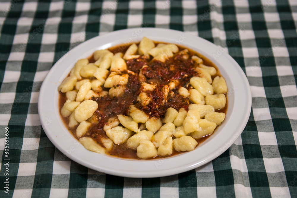 Plate of homemade gnocchi with tomato sauce Plate of homemade gnocchi with tomato sauce
