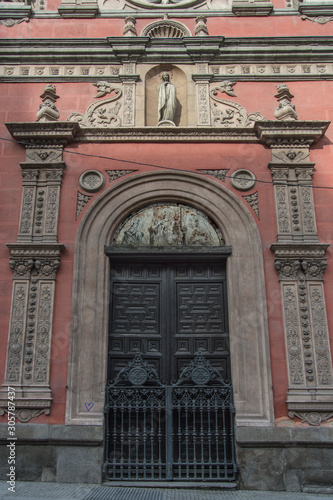 entrance with neo-plateresque door of the church of Las Calatravas in Madrid. Spain photo