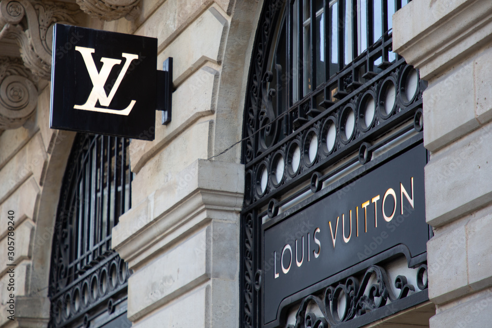 Louis Vuitton logo store sign Luxury brand shop handbags luggage Stock ...