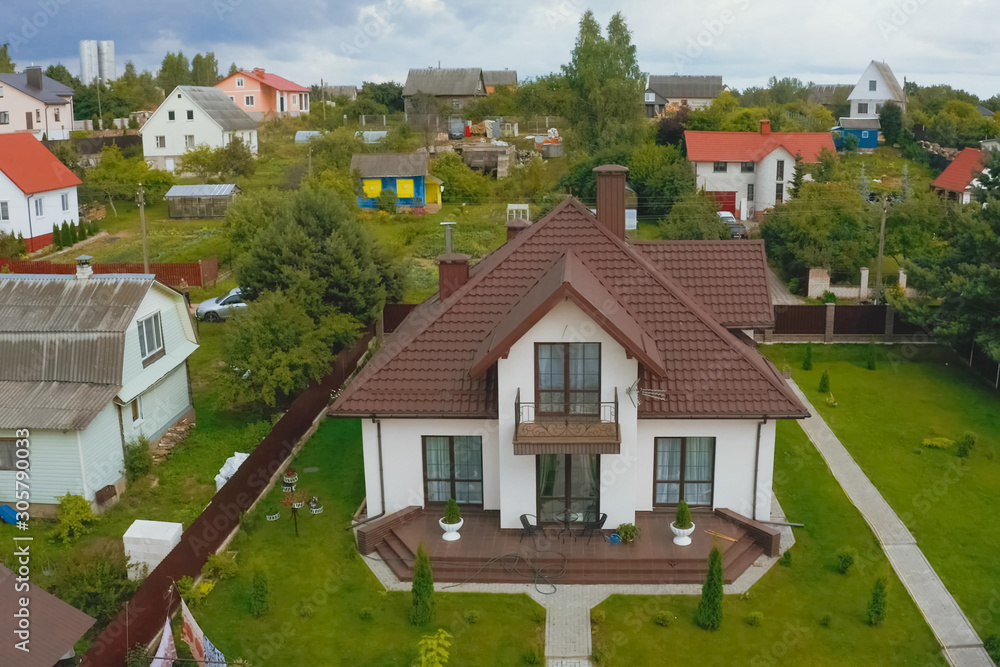 new house, the roof of which is made of metal. Cottage in the co new house, the roof of which is made of metal. Cottage in the co