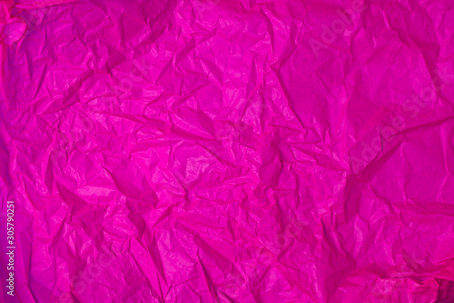 The texture of crumpled purple crumpled paper