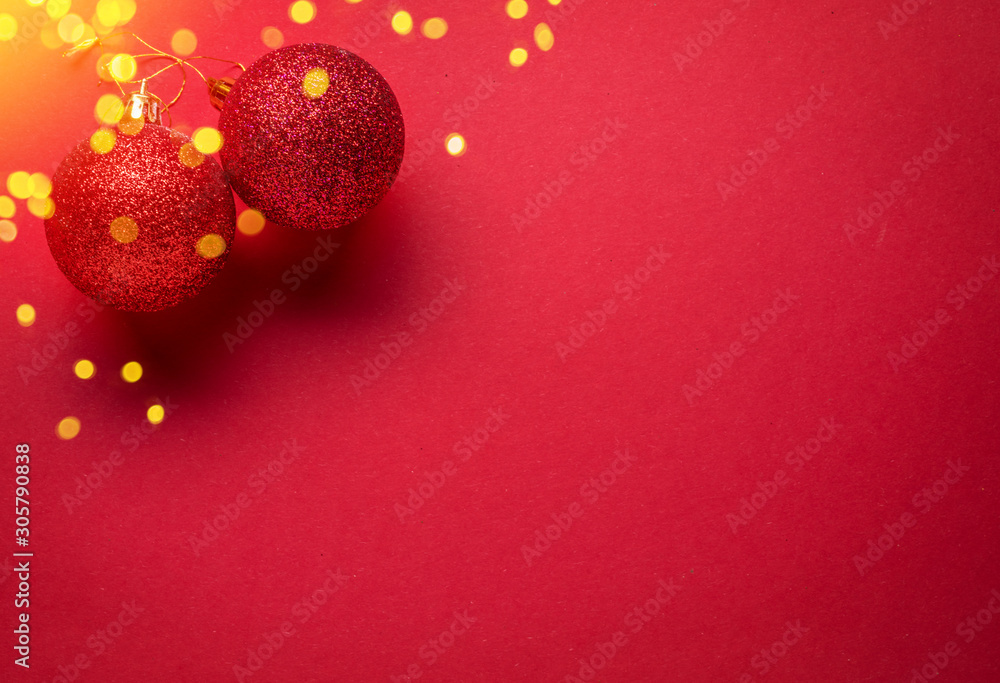 Red New Year or Christmas background and red sparkling christmas balls on it. Red New Year or Christmas background and red sparkling christmas balls on it.