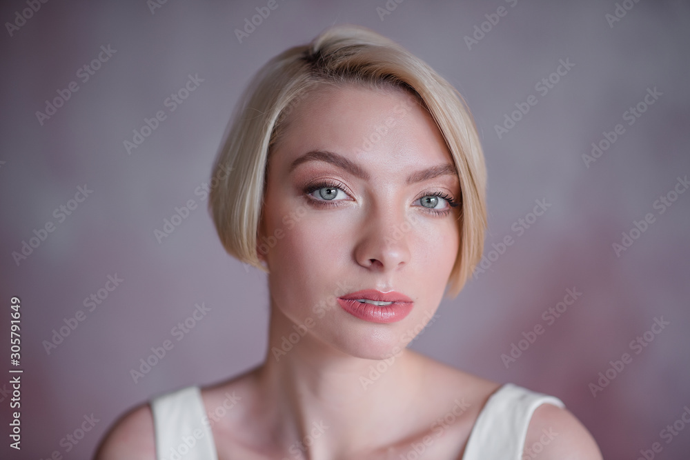 Modern beauty fashion bride. Bride with short blond hair. The bold image of the bride.