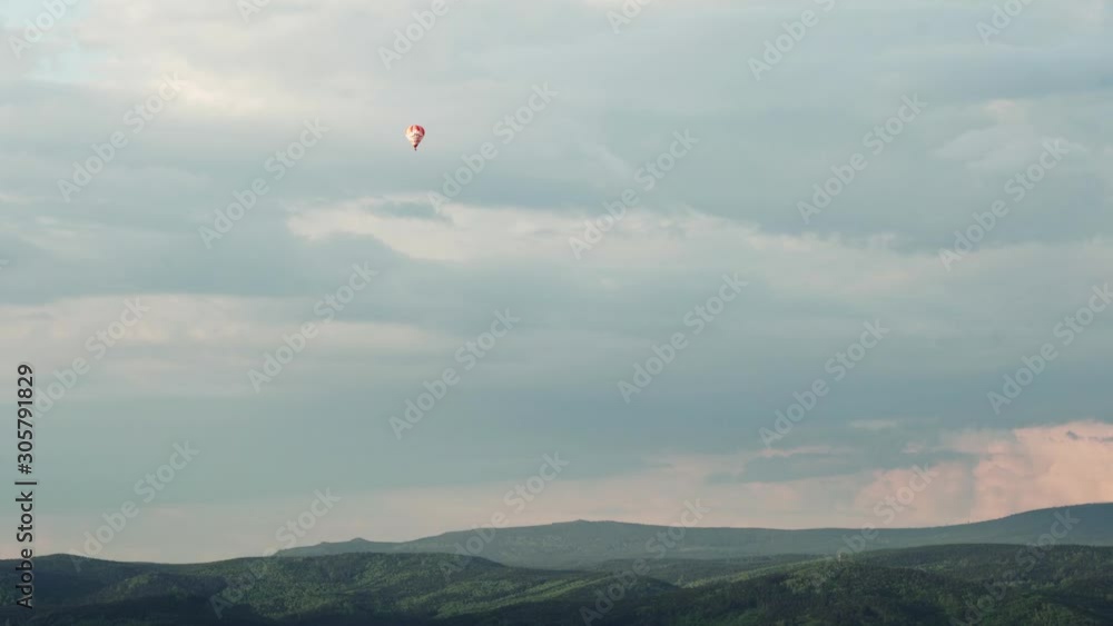 Hot Air Balloon flying over forests and hills near Liberec, Czech Republic Hot Air Balloon flying over forests and hills near Liberec, Czech Republic