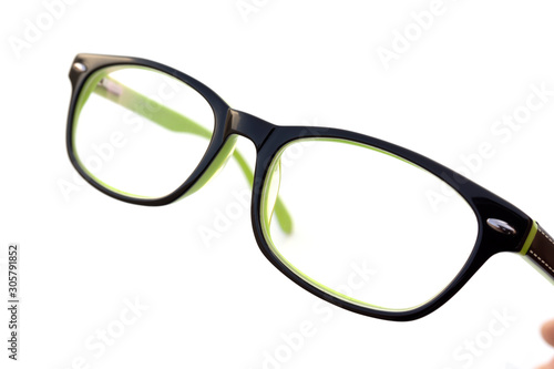 Modern reading glasses in green color with black trim.