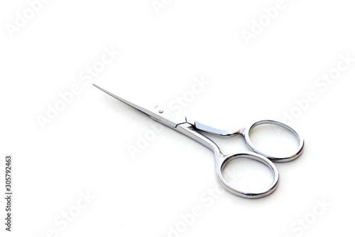 Pair of silver scissor on white background. © Atthapon