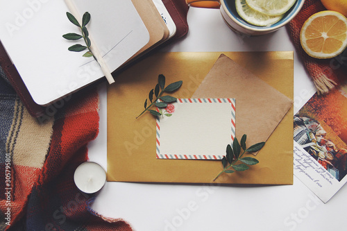 Opened book and leaves, postcard, winter home comfort