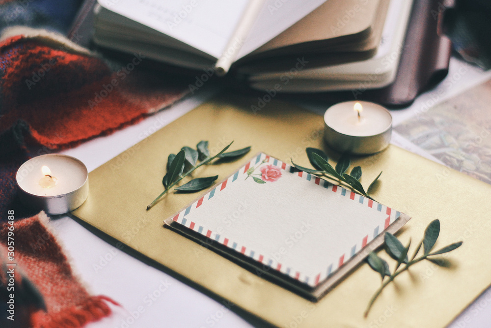 Opened book and leaves, postcard, autumn home comfort