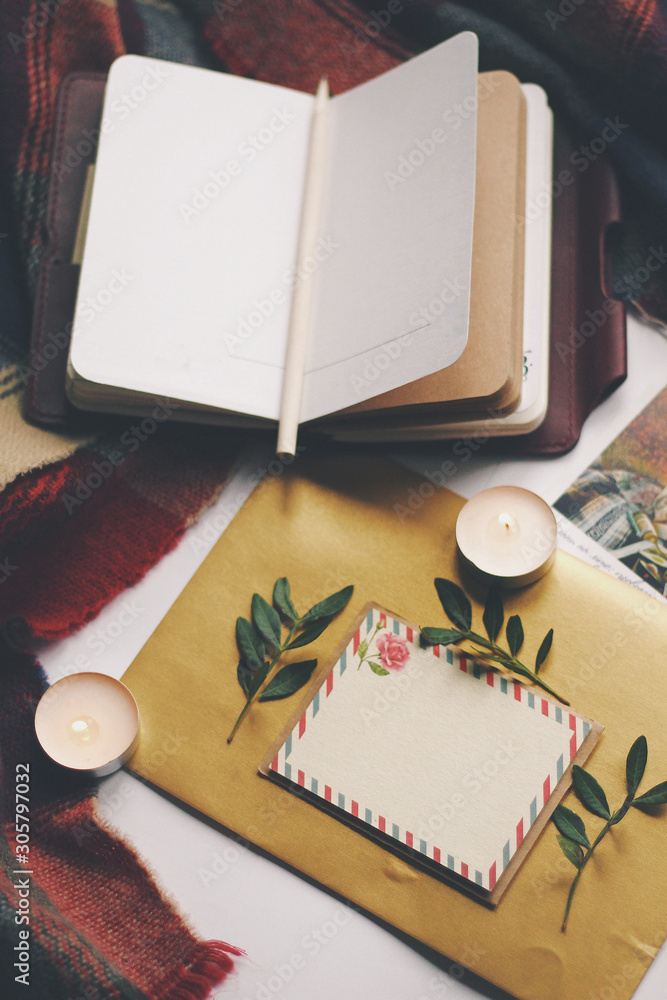 Opened book and leaves, postcard, autumn home comfort
