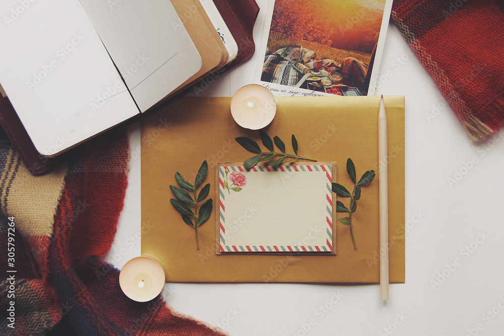 Opened book and leaves, postcard, autumn home comfort