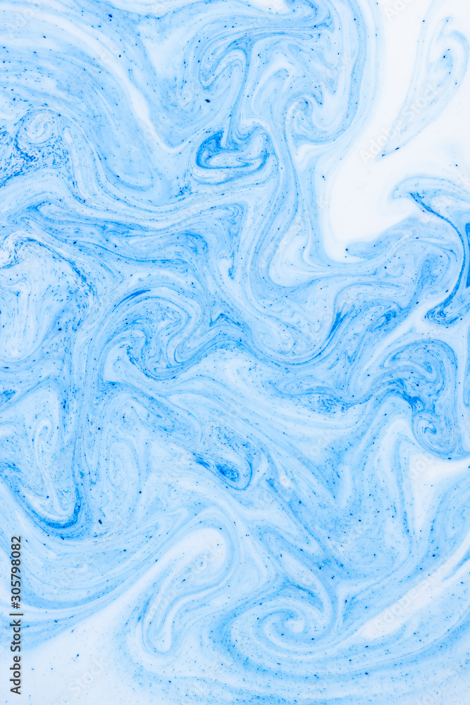 Fluid Art with white blue color. Abstract multicolored background. Blue white texture. Colored paint stains in liquid. Marble art. Fantastic iridescent colors
