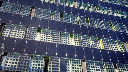 The walls of the building are tiled with solar panels.